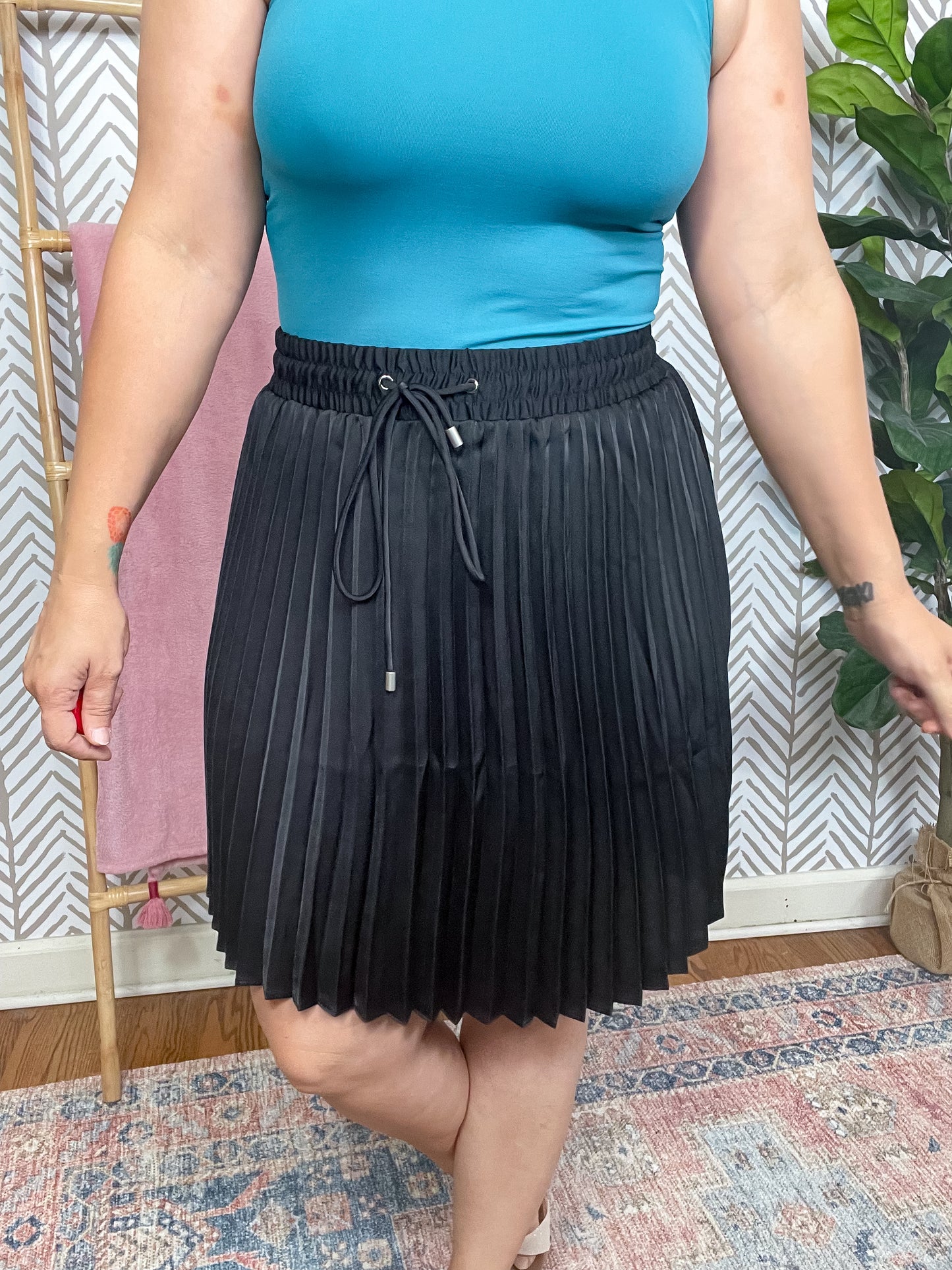 Just a Flirt Pleated Skirt in Black